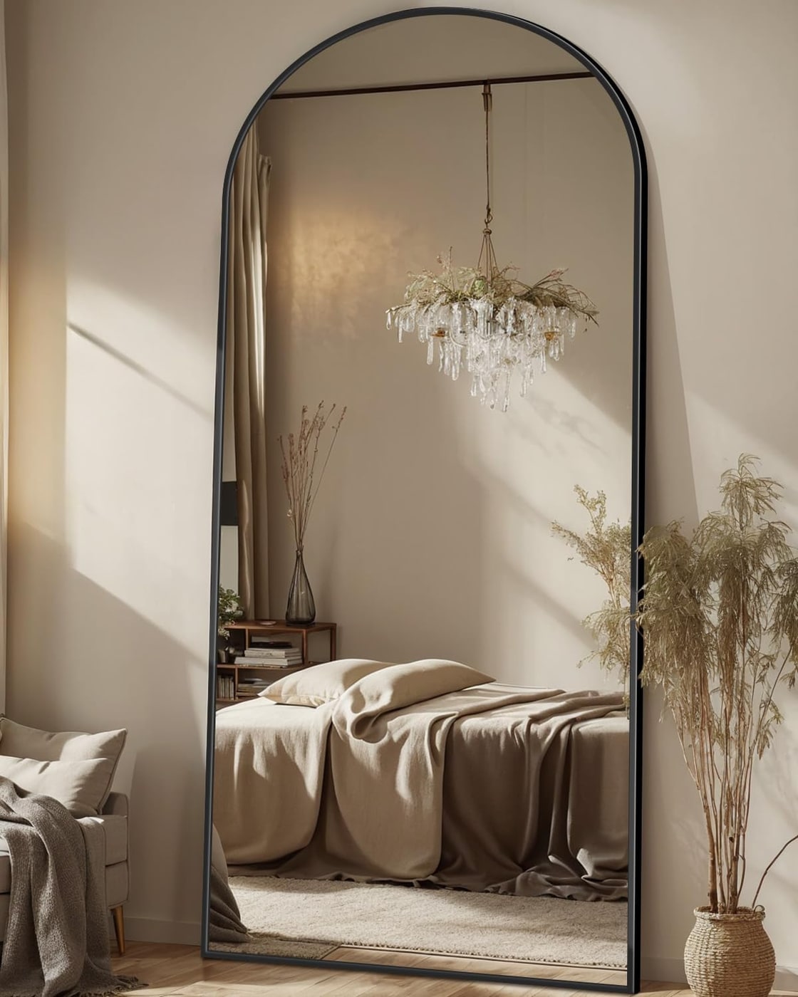 Tall arched full-length mirror with slim aluminum frame, shown leaned against a wall