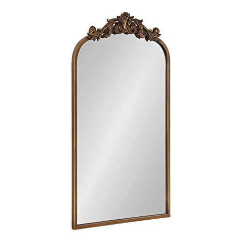 Arched baroque wall mirror with ornate metal scrollwork frame in a hand-applied finish