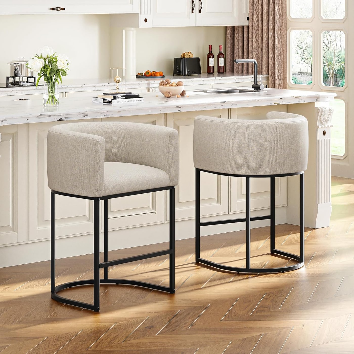Pair of barrel-back upholstered counter stools in linen with chrome legs