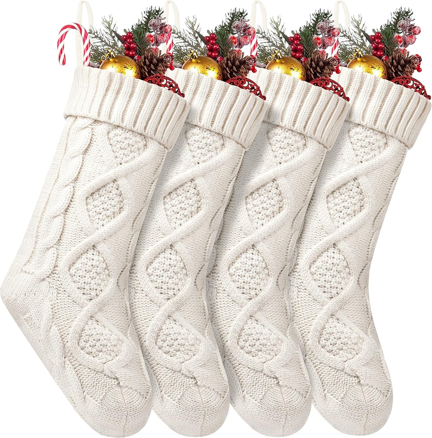 A set of four ivory cable knit Christmas stockings with loop hangers, laid out in a row