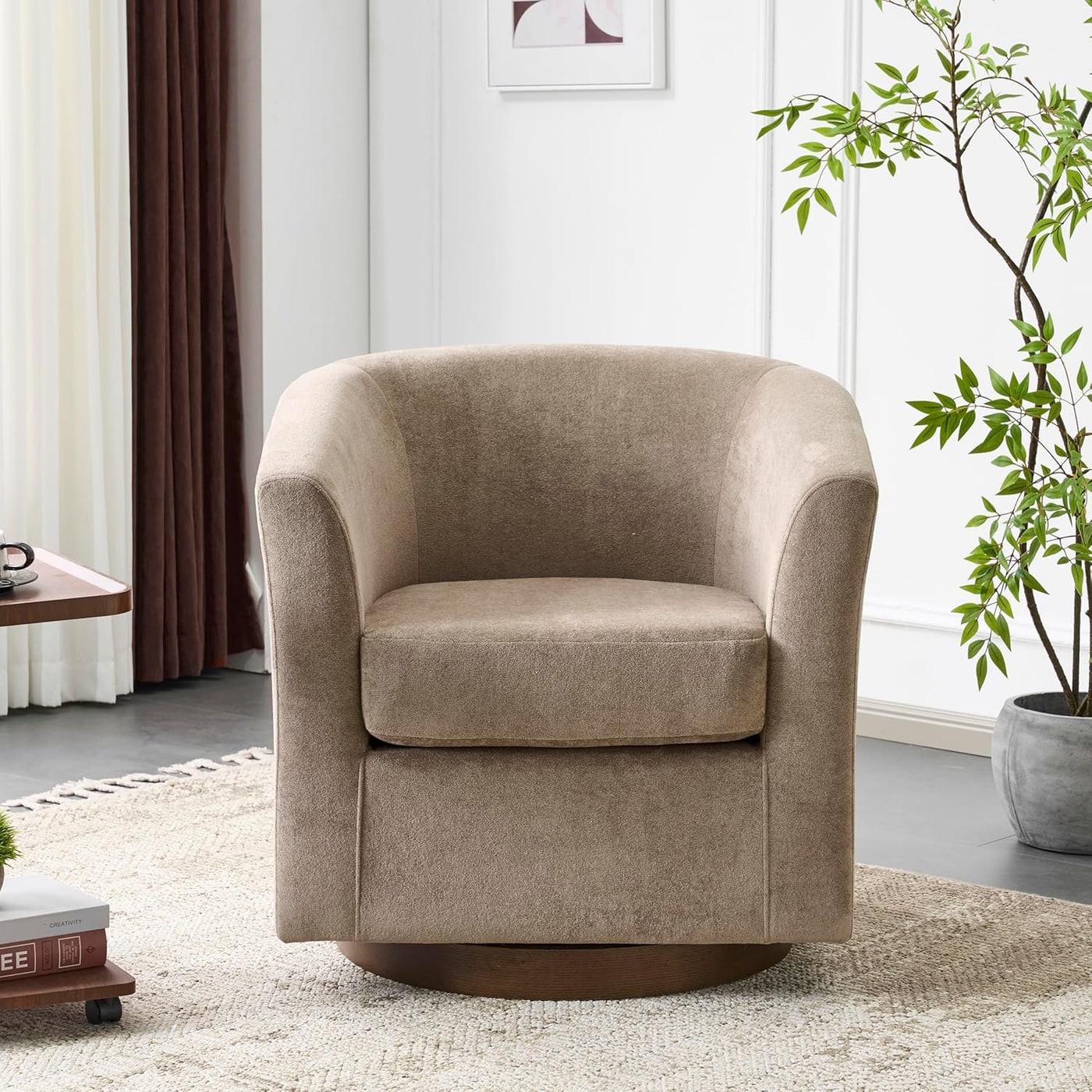 Light brown velvet barrel swivel chair with walnut bentwood base and plush, curved design