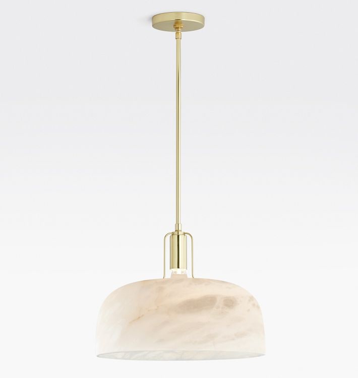 Hand-carved Italian alabaster pendant light with a solid brass dome frame from Rejuvenation, softly glowing with visible stone veining.