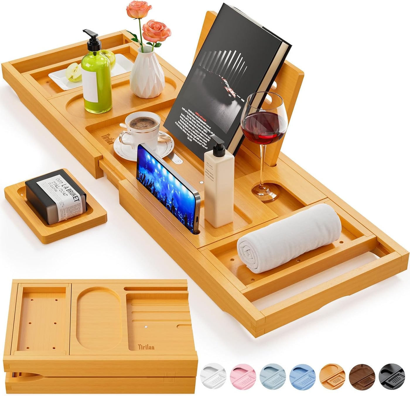 Expandable bamboo bath tray with book rest and slots for wine glass and phone on a bathtub