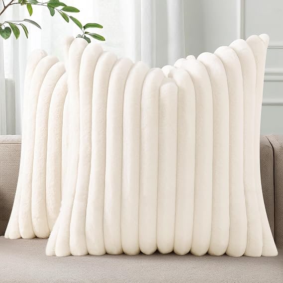 Two ribbed faux fur striped throw pillow covers in a soft, plush finish, displayed on a white background.