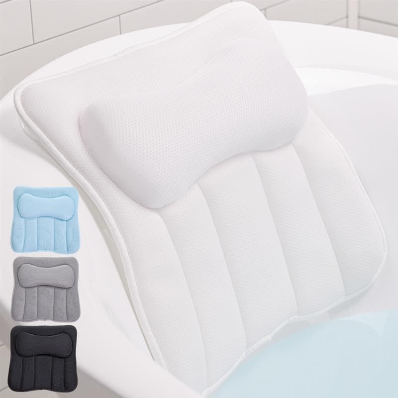 White mesh bath pillow with foam padding and suction cups attached to a smooth bathtub wall.