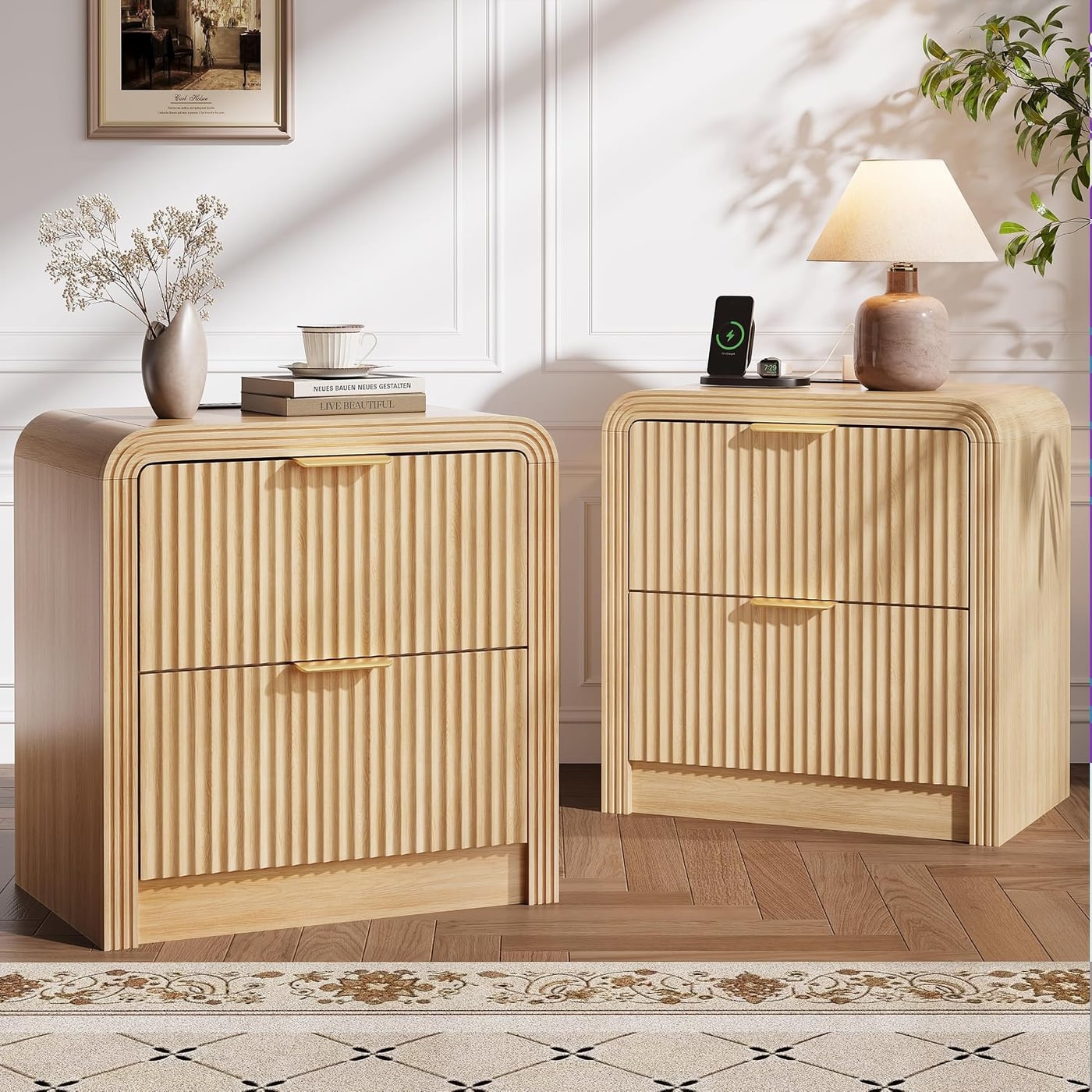 Decofy wide fluted nightstand in white finish with gold handles and two drawers, next to a bed