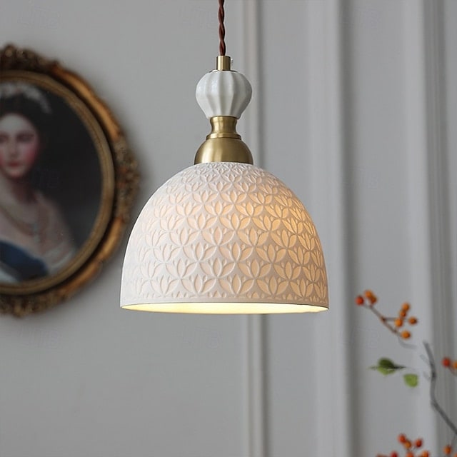 Matte white ceramic dome pendant light with smooth finish and simple hanging cord