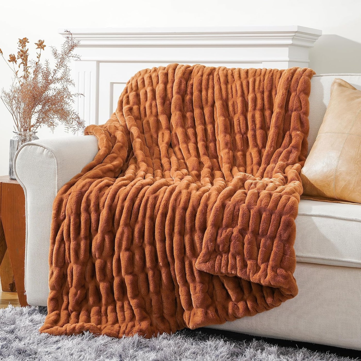 Reversible faux fur bubble-textured throw blanket folded to show its plush double-sided design