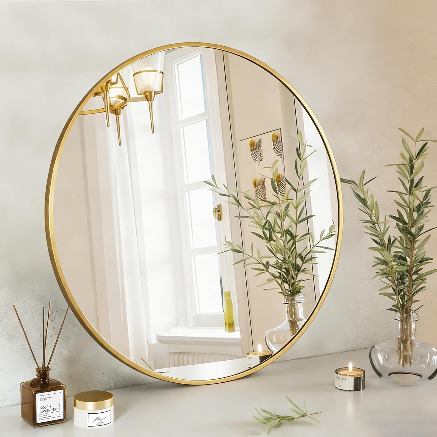 30-inch round wall mirror with a slim gold metal frame, reflecting a clear image