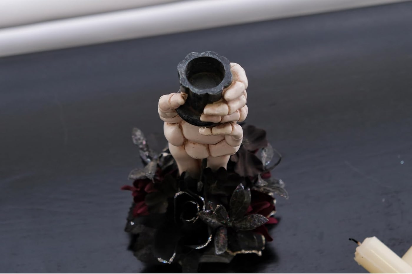 Resin Skeleton Hand Candlestick with Black Faux Flower - Photo 3