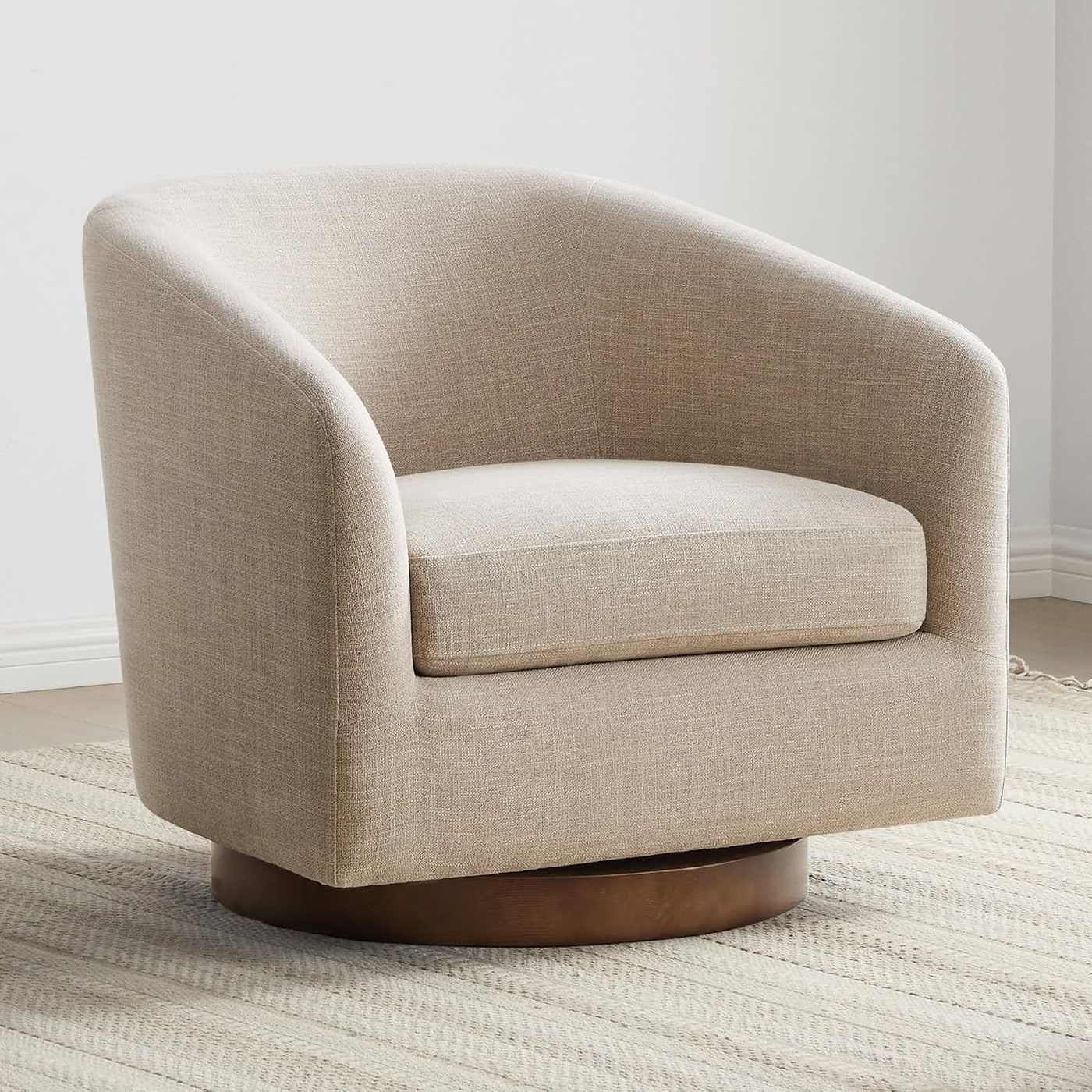 Curved barrel swivel accent chair with walnut-finished wood base and upholstered seat