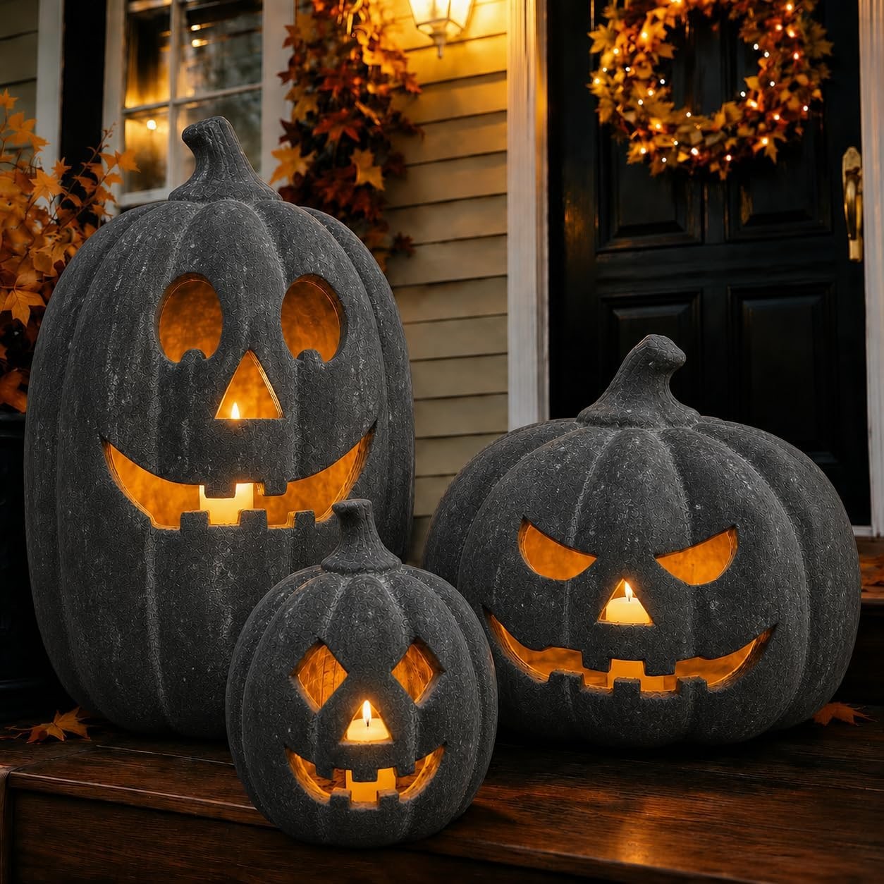 A handcrafted terracotta jack-o'-lantern pumpkin with visible texture, carved face, and a warm flameless candle glow inside