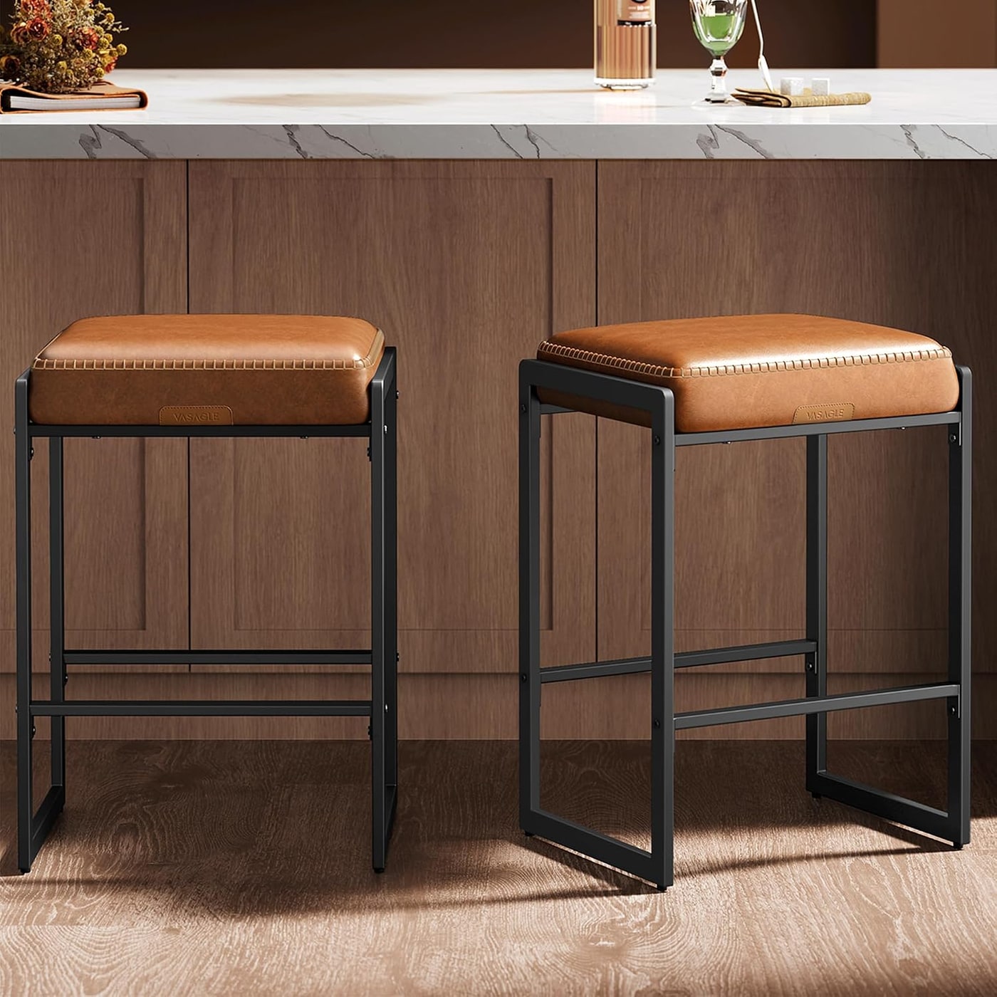 Pair of EKHO Counter Height Bar Stools with stitched faux leather seats and matte steel legs