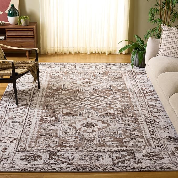 Vintage Hamadan Persian area rug in warm brown and ivory with traditional medallion pattern on a living room floor